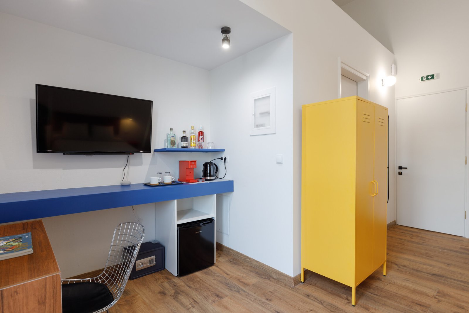 mini bar space, TV and yellow closet of Baroness 3